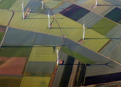 grass field with wind turbines